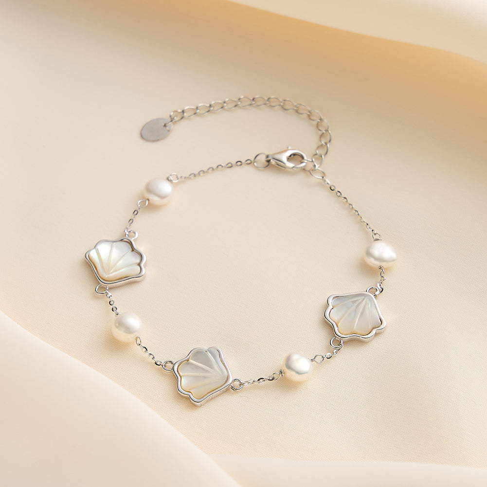 Sterling silver pearl shell bracelet displayed on soft background – elegant jewellery for women