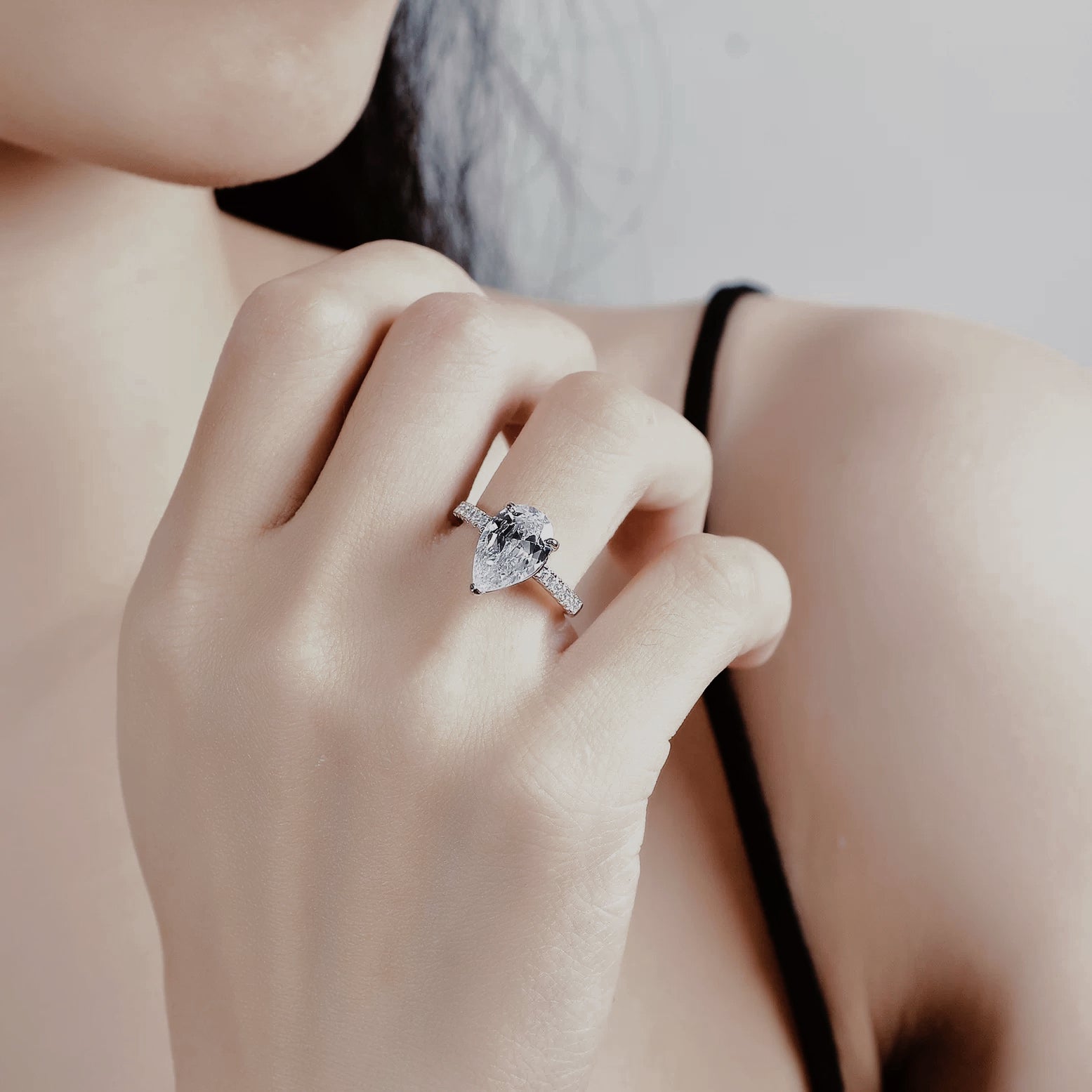 Pear-shaped cubic zirconia engagement ring in sterling silver, photographed for Lotus And Rose jewellery collection