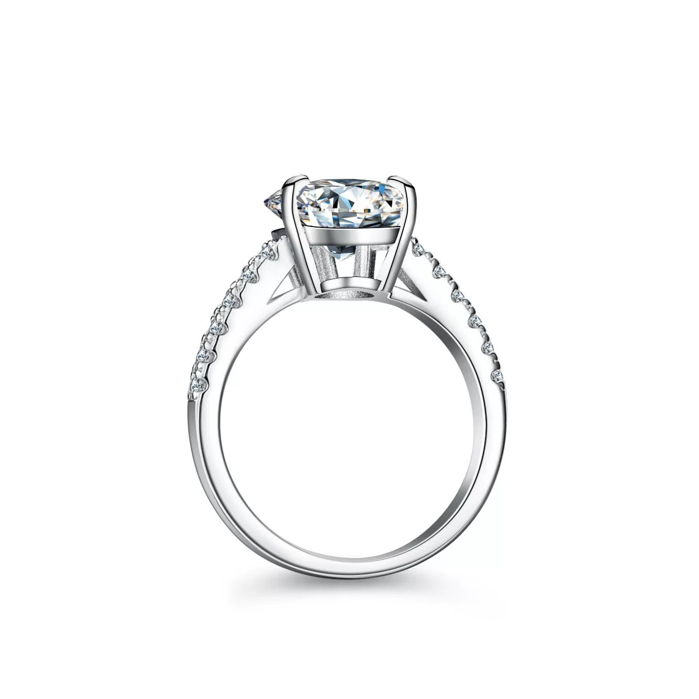 Close-up of pear-cut sterling silver engagement ring with sparkling pavé-set band