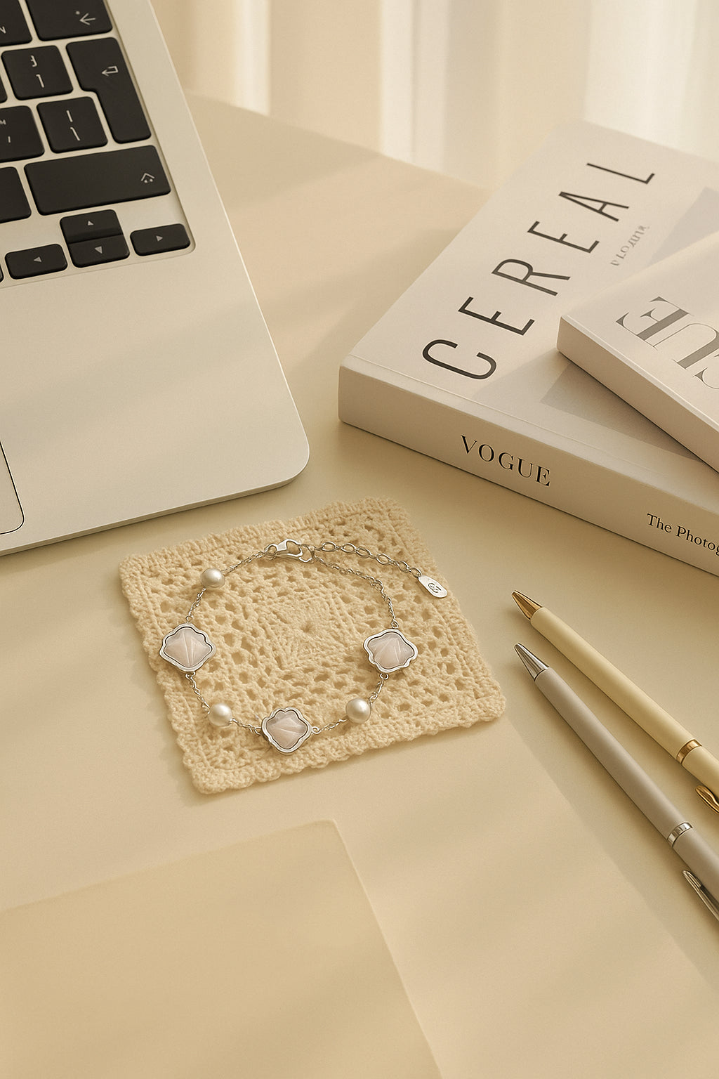 Elegant sterling silver pearl shell bracelet styled on a desk with Vogue magazine – dainty minimalist jewelry gift for her.