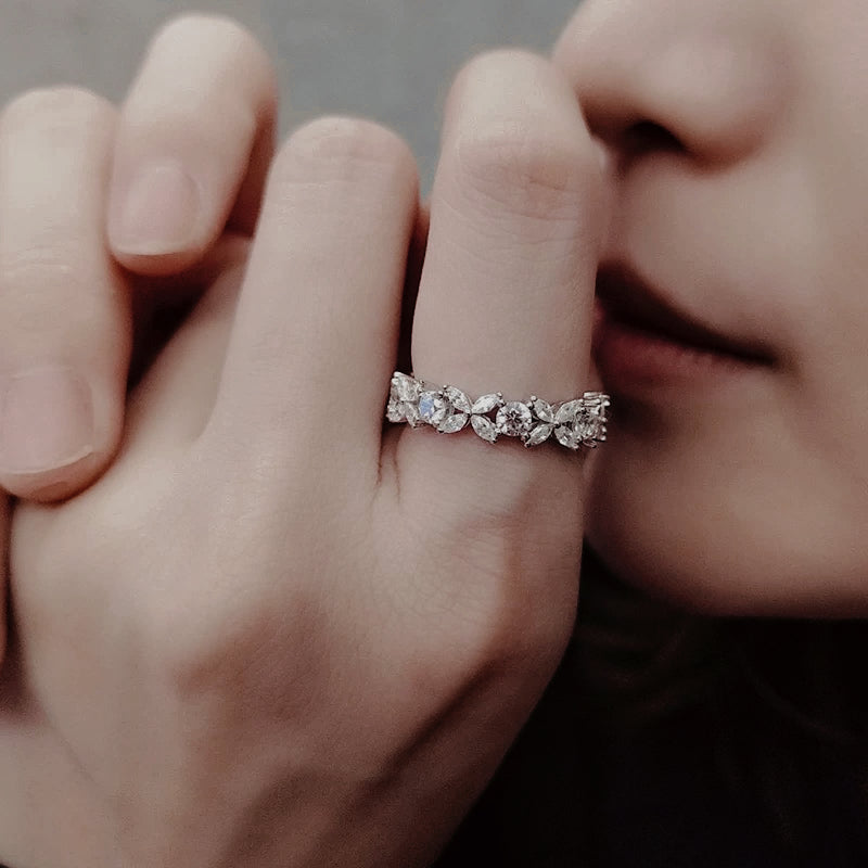 Woman_wearing_Eterna_Petal_Band_sterling_silver_floral_eternity_ring_with_petal-shaped_details