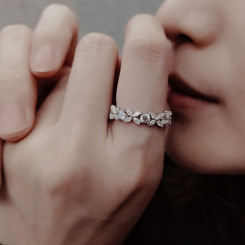Woman_wearing_Eterna_Petal_Band_sterling_silver_floral_eternity_ring_with_petal-shaped_details
