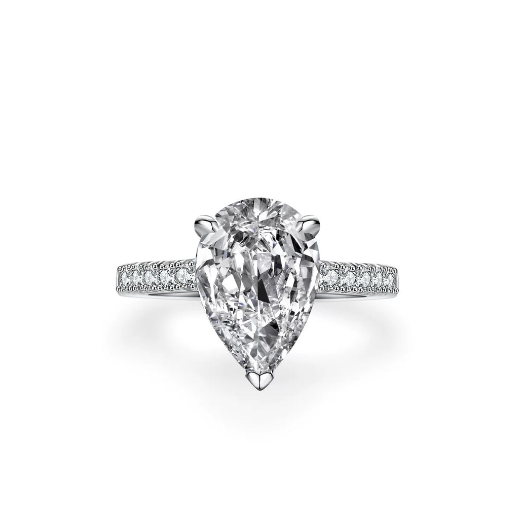 Side view of sterling silver pear-cut engagement ring with micro pavé band